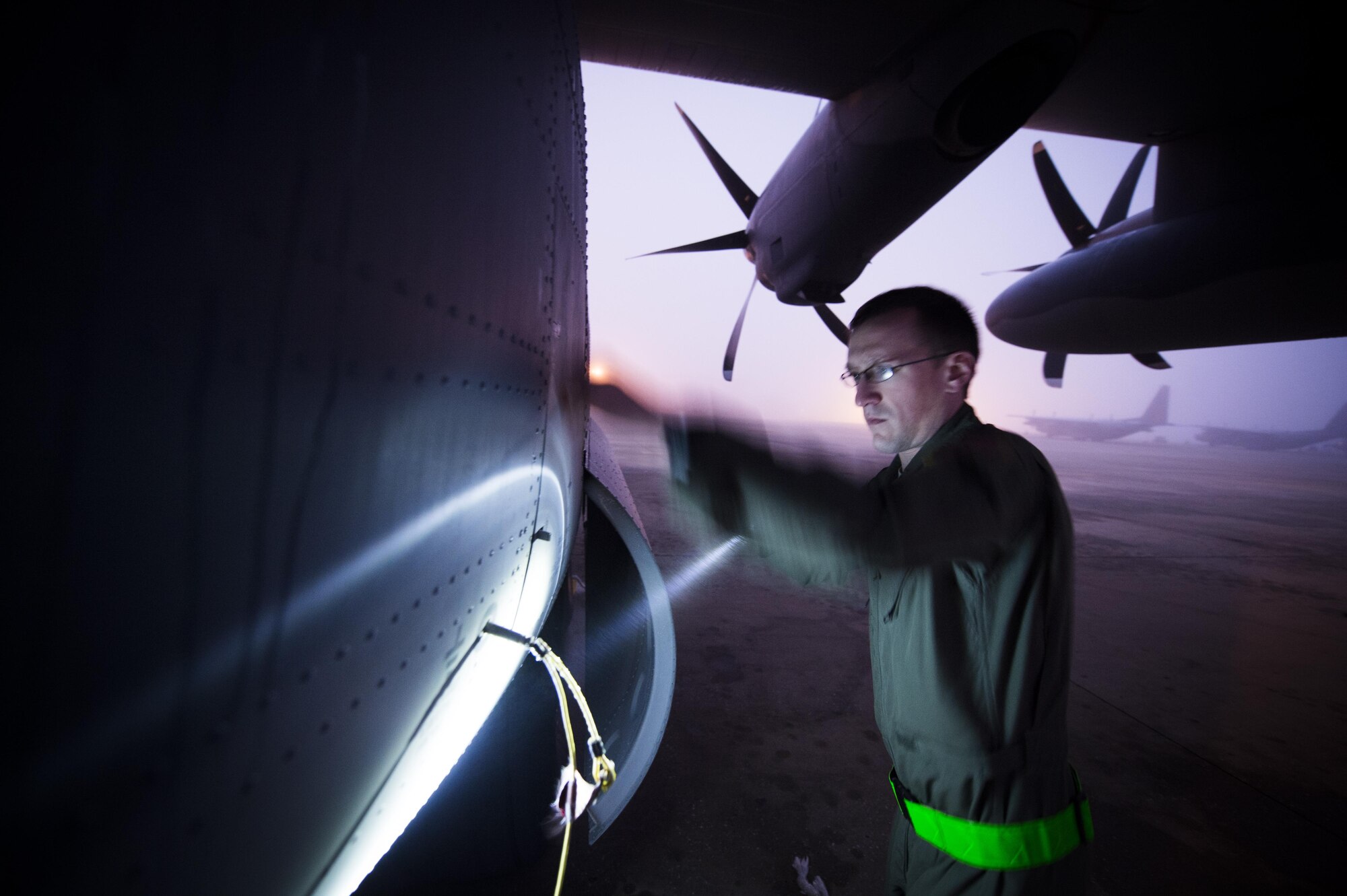 Staff Sgt. Derek Watson, a special missions aviator with the 1st Special Operations Group Detachment 2, inspects a panel of an AC-130J Ghostrider during a pre-flight inspection at Hurlburt Field, Fla., Feb. 2, 2016.  Special mission aviators cover everything from pre-flight inspections of aircraft systems to the placement and delivery of all cargo on board. (U.S. Air Force photo by Staff Sgt. Christopher Callaway) 