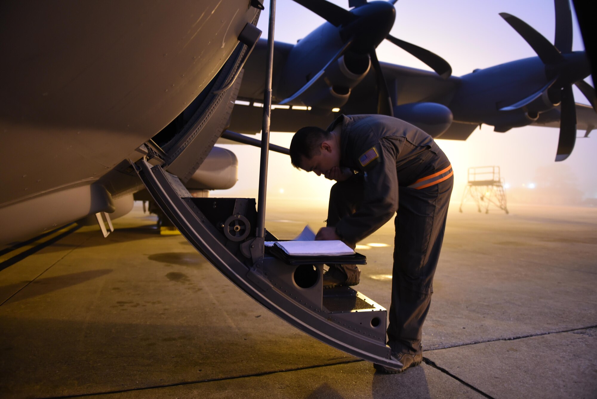 Staff Sgt. Joshua Thorn, a special missions aviator with the 1st Special Operations Group Detachment 2, reviews forms before performing a pre-flight inspection onboard an AC-130J Ghostrider at Hurlburt Field, Fla., Feb. 2, 2016. Special mission aviators cover everything from pre-flight inspections of aircraft systems to the placement and delivery of all cargo on board. (U.S. Air Force photo by Staff Sgt. Christopher Callaway) 