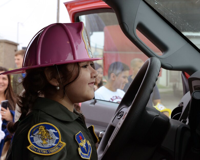 Ariana Meza looks through the windshield of a fire department vehicle, at Laughlin Air Force Base, Texas, March 18, 2016. During her visit, Meza was able to see the fire department, a military working dog demonstration and the tower. (U.S. Air Force photo by Senior Airman Jimmie D. Pike)