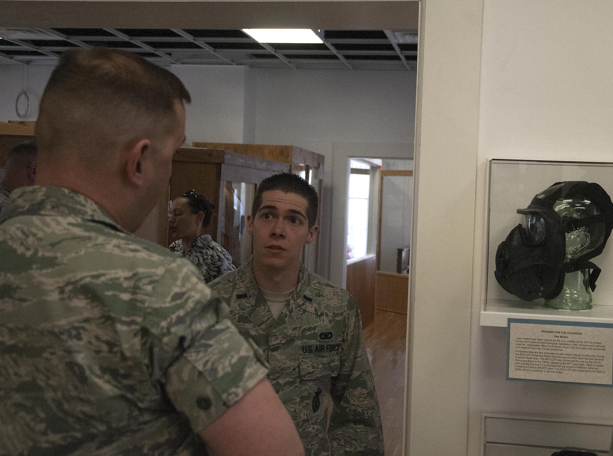 1st Lt. Alexander Franklin, 90th Security Forces Squadron flight commander, speaks with Lt. Col. Jereme Barrett, 90th Security Forces Group deputy commander, about the new exhibit, “Security Forces: The Tale of the Blue Beret,” March 21, 2016, inside the Warren ICBM and Heritage Museum on F.E. Warren Air Force Base, Wyo. Franklin, along with Tech. Sgt. Andrew Hogue and Airman 1st Class Brandon Dahl, 90th SFS Airmen, spent three months preparing the exhibit’s displays. (U.S. Air Force photo by Senior Airman Brandon Valle)