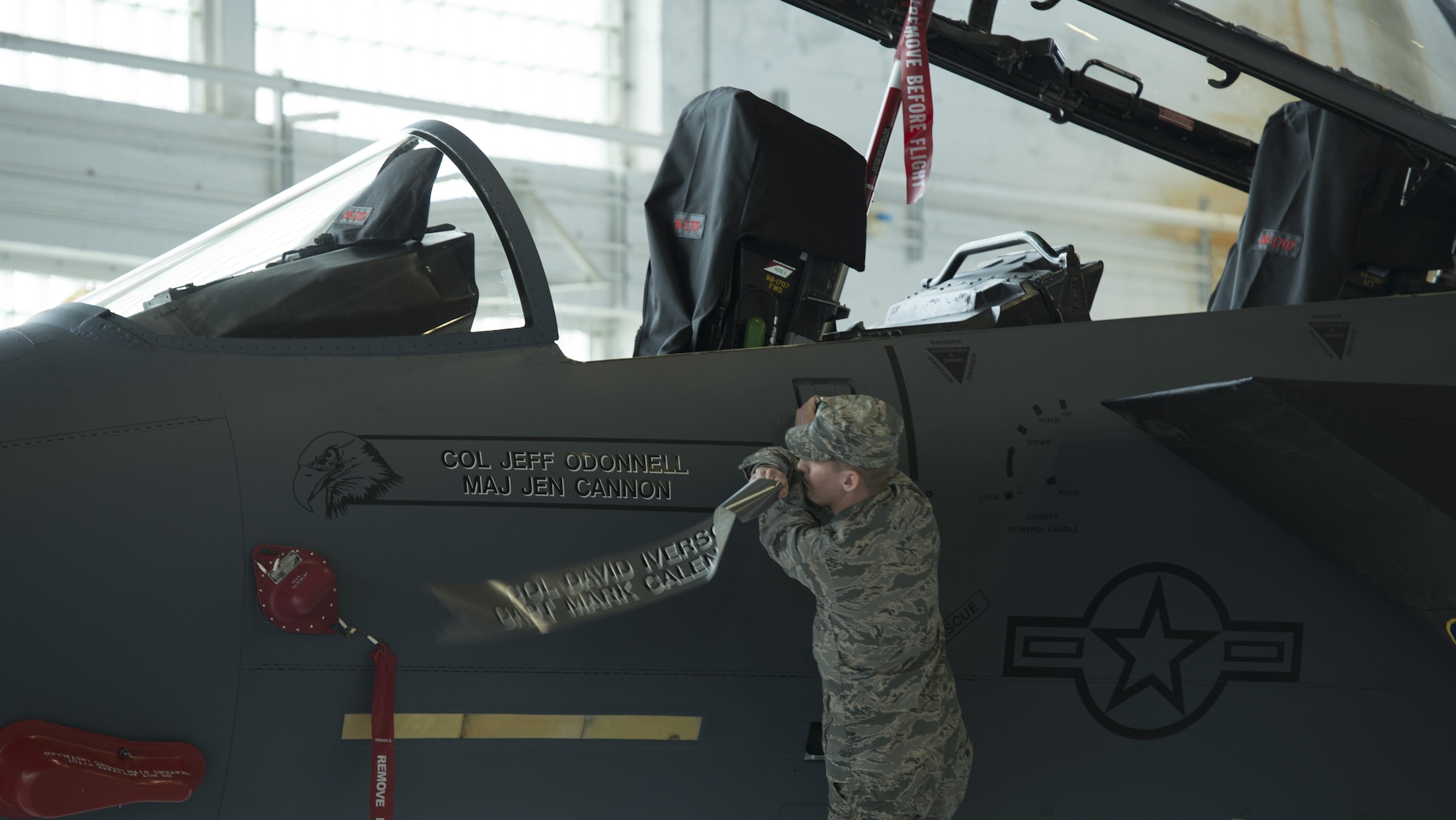 Col. Jefferson O'Donnell's name is revealed on the side of the F-15E Strike Eagle flag ship, March 24, 2016, at Mountain Home Air Force Base, Idaho. O'Donnell currently has approximately 2,500 flight hours in the T-3, T-37, T-38, F-15E and the F-15SG. (U.S. Air Force photo by Senior Airman Malissa Lott/Released)