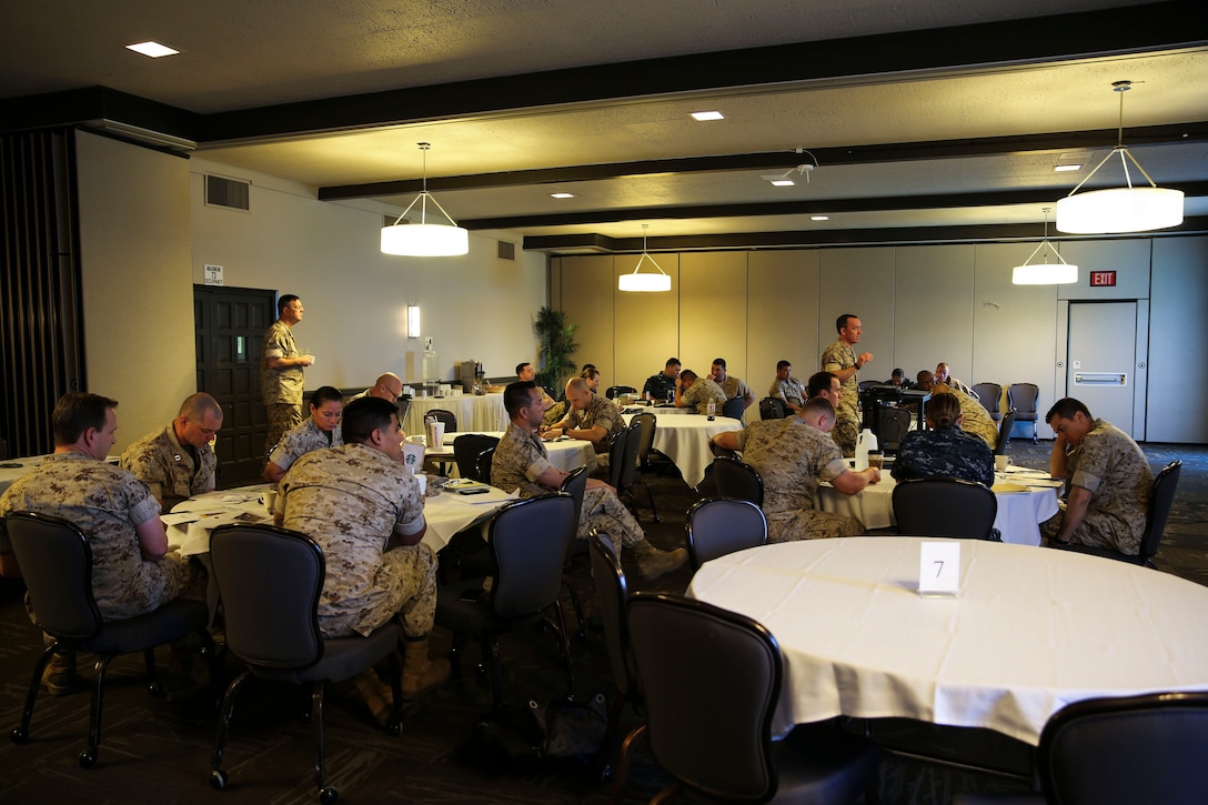 Navy medical personnel receive instruction before beginning the practical application portion of a SoCal Medical Planning Symposium aboard Marine Corps Air Station Miramar, Calif., March 25. This was the third time the I Marine Expeditionary Force Surgeon’s Office has hosted this event with the intent to broaden medical personnel’s basic knowledge of the medical planning process. (U.S. Marine Corps photo by Cpl. Alissa P. Schuning/Released)