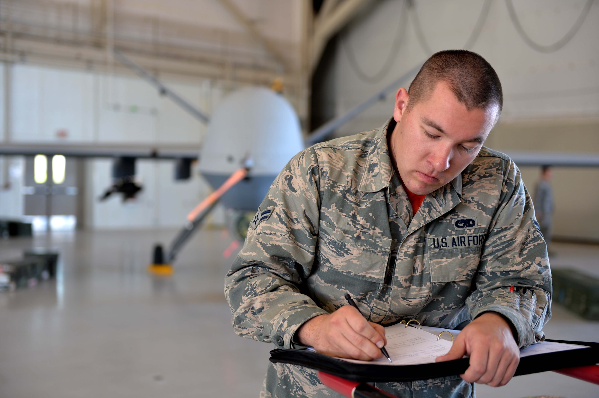 Airman 1st Class Stuart, 432nd AMXS weapons load crew member, prepares for the 2015 Load Crew of the Year competition March 10, 2016, at Creech Air Force Base, Nevada. Stuart was selected from Tiger Aircraft Maintenence Unit to load munitions for the competition based on his performance in the unit.