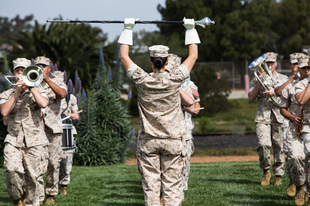 Staff Sgt. Monica Preston, assistant drum major and clarinet instrumentalist with the 3rd Marine Aircraft Wing Band and Massillon, Ohio native, leads a band practice aboard Marine Corps Air Station Miramar, Calif., March 22. Marines with the 3rd MAW Band practice daily to prepare for future events and ceremonies. (U.S. Marine Corps photo by Sgt. Lillian Stephens/Released)