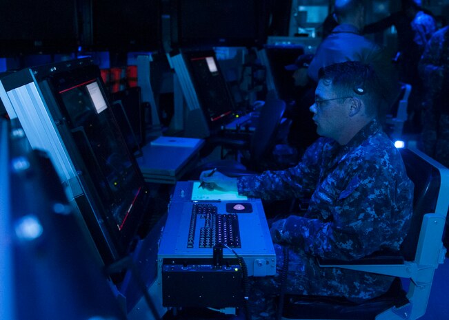 160322-N-DI878-070 (March 22, 2016) SAN DIEGO – USS Carl Vinson (CVN 70) Air Traffic Controller 1st Class  David Shoemaker demonstrates the first air traffic control simulator installed on board a Navy aircraft carrier in the aircraft carrier USS Carl Vinson air traffic control center (CATCC). Carl Vinson is currently pierside in its homeport of San Diego. (U.S. Navy photo by Mass Communication Specialist 3rd Class Giovanni Squadrito/Released)