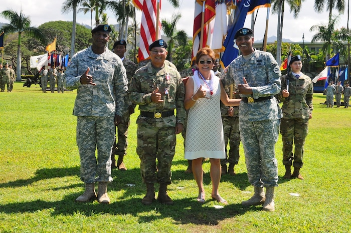 U.S. Army Pacific Deputy Commanding General - National Guard, Maj. Gen. Gary Hara (center-left), flashes the Shaka, along with Gen. Vincent Brooks (center-left), USARPAC Commanding General Vincent K. Brooks (right), USARPAC Command Sgt. Maj. Bryant Lambert (left), and Hara's wife, Dianne, during his retirement ceremony held at historic Palm Circle, Fort Shafter, Hawaii, March 23, 2016. The ceremony honored Hara's retirement after 47 years of service. He had been with USARPAC since 2013, during which time he operated as the Deputy Commanding General of the ARNG after USARPAC was elevated from a 3-star command to a 4-star command as part of the Asia-Pacific strategic rebalance. (U.S. Army photo by Staff Sgt. Chris McCullough, USARPAC Public Affairs)