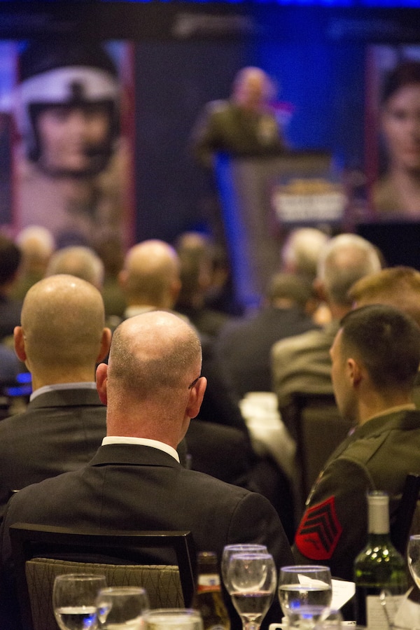 U.S. Marines and guests listen to Commandant of the Marine Corps Gen. Robert B. Neller speak during the 12th Marine Corps Association and Foundation Ground Logistics Awards dinner at the Crystal Gateway Marriot, Arlington, Va., March 24, 2016. The annual event recognized the professional achievements of the top performing Marine logisticians and logistics unit of the year for the previous year. (U.S. Marine Corps photo by Staff Sgt. Gabriela Garcia/Released)