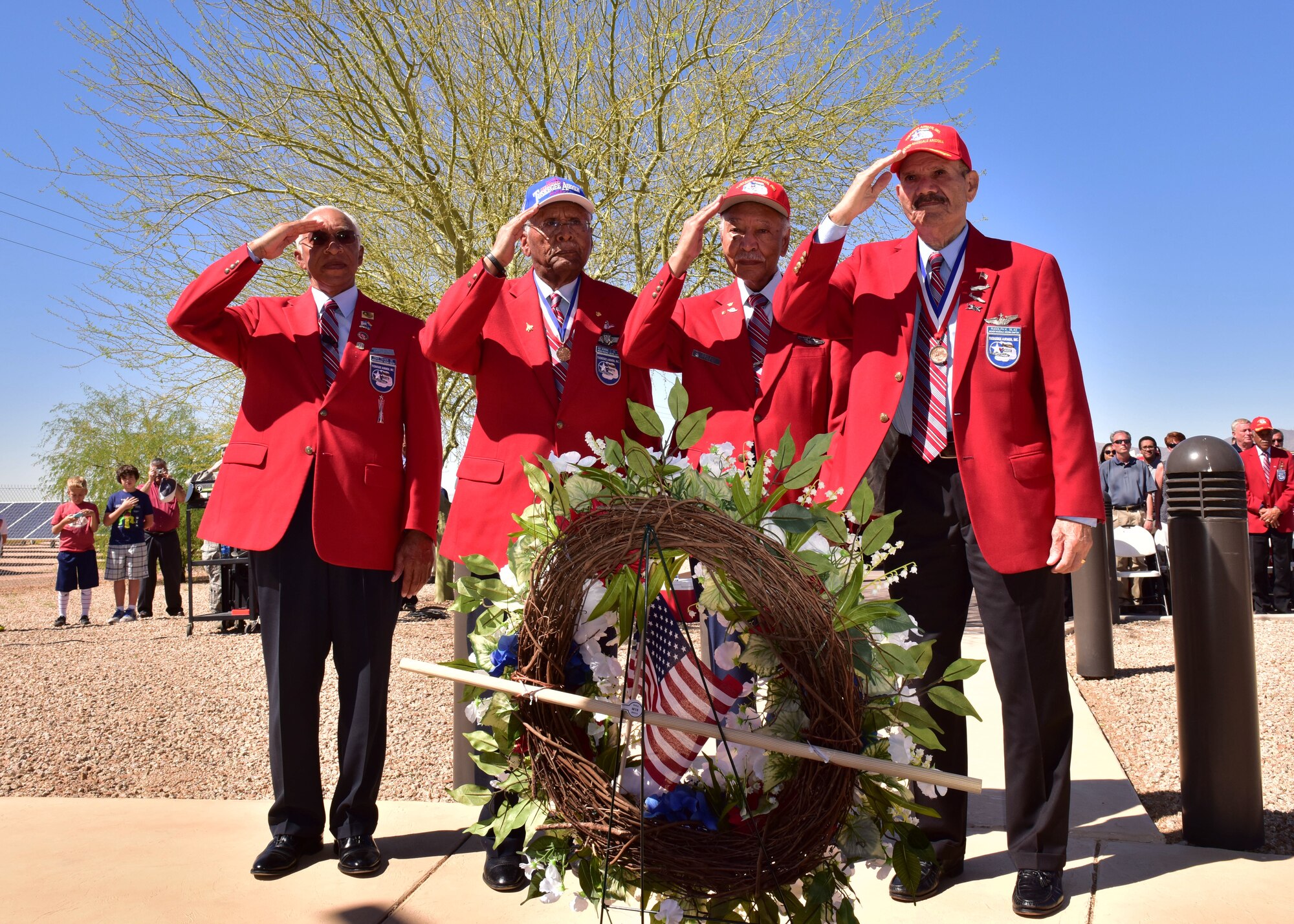 (from left to right) Mr. David Toliver, founding member of the Archer-Ragsdale Arizona Chapter of Tuskegee Airmen, Lt. Col. (Ret.) Asa Herring, Lt. Col. (Ret.) Robert Ashby, and Tech. Sgt. (Ret.) Rudolf Silas, original Tuskegee Airmen, salute Mar. 24 during the Laying of the Wreath portion of the 3rd Annual Tuskegee Airmen Commemoration Day on Luke Air Force Base, Ariz. (U.S. Air Force photo by Tech. Sgt. Louis Vega Jr.) #Tuskegee75