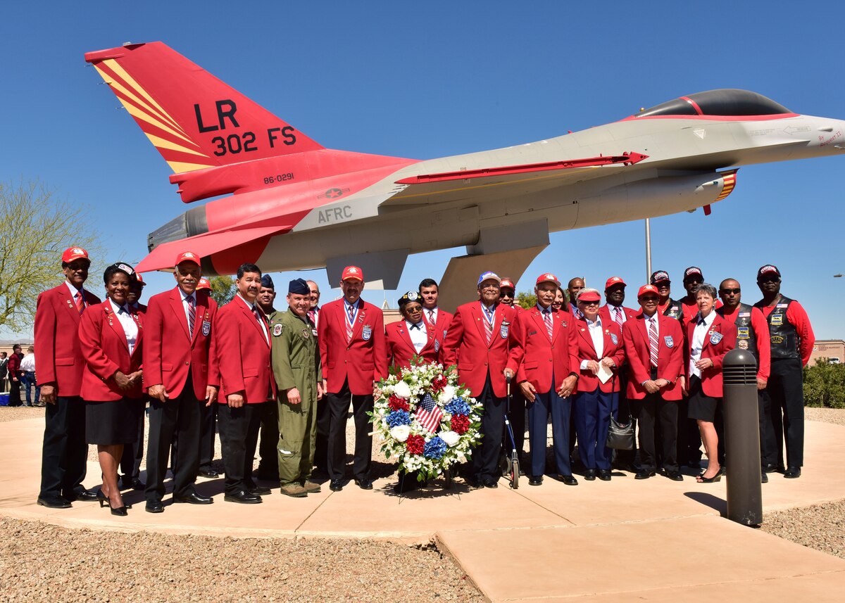 Col. Kurt Gallegos, 944th Fighter Wing commander, participates in a group photo with original members of the Tuskegee Airmen and members of the Archer-Ragsdale Arizona Chapter of Tuskegee Airmen Mar 24 after the 3rd Annual Tuskegee Airmen Commemoration Day on Luke Air Force Base, Ariz. (U.S. Air Force photo by Tech. Sgt. Louis Vega Jr.) #Tuskegee75