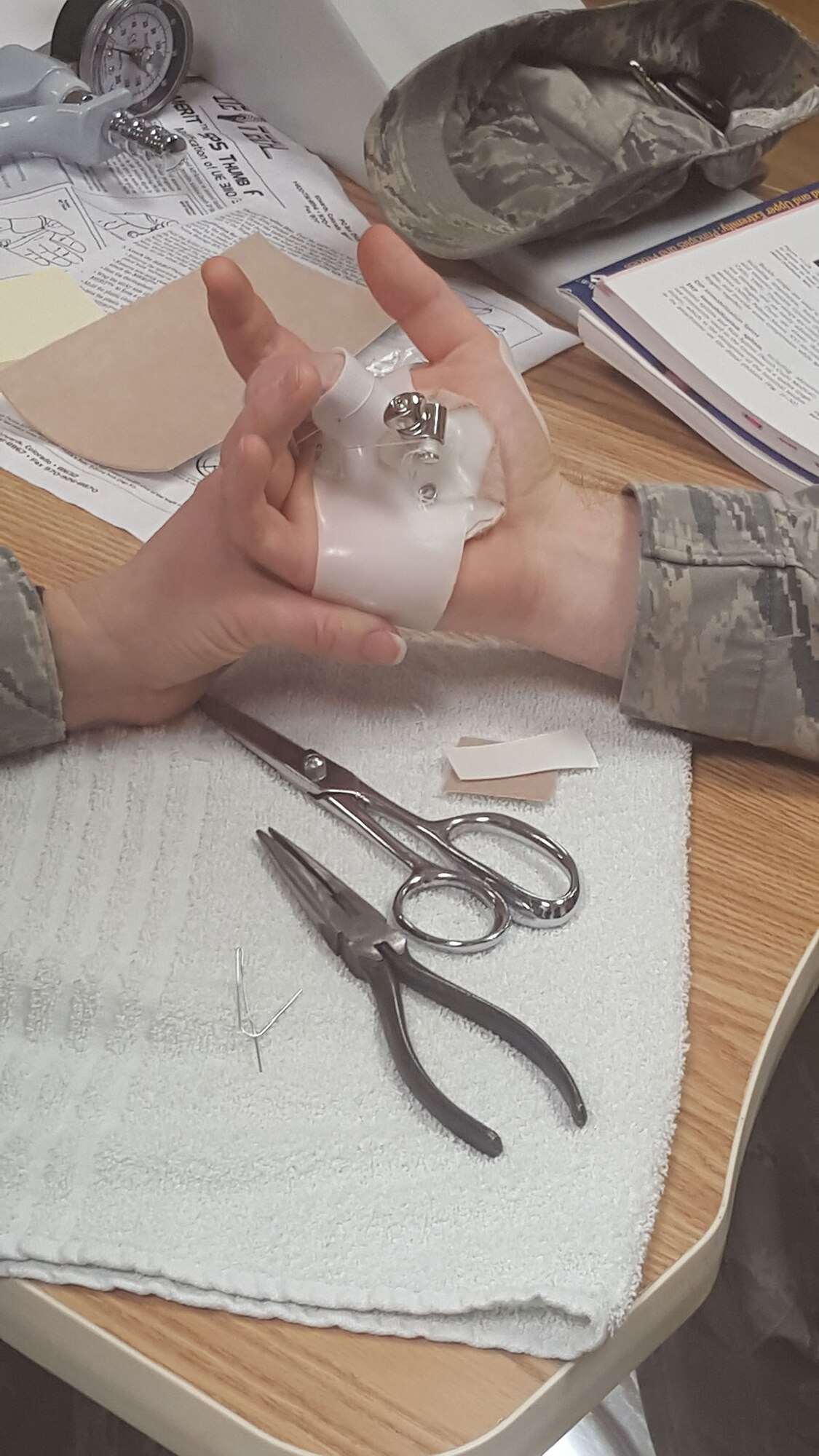 Air Force Master Sgt. Robert Wagner, 773d Civil Engineer Squadron primary security manager, tries on a dynamic splint on his right middle finger at the Joint Base Elmendorf-Richardson hospital Feb. 26, 2016. He injured his finger in October while blocking a ball as the goalie on the CE team during intramural soccer. (Courtesy Photo)