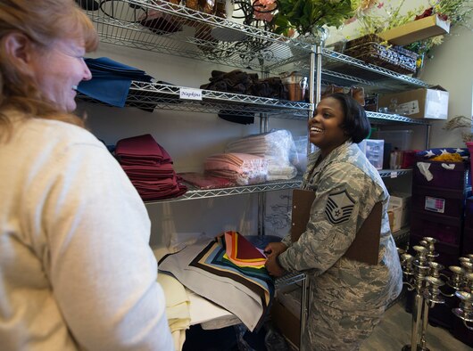 U.S. Air Force Master Sgt. Shonda Simes, the 509th Force Support Squadron NCO in charge of food and beverage, right, works with Karen O’Camb, the Mission’s End club manager, to select the décor for the 2016 Women's History Month Celebration Breakfast at Whiteman Air Force Base, Mo., March 21, 2016. The theme for this year's celebration is Working to Form A More Perfect Union:  Honoring Women in Public Service and Government. (U.S. Air Force photo by Senior Airman Sandra Marrero)