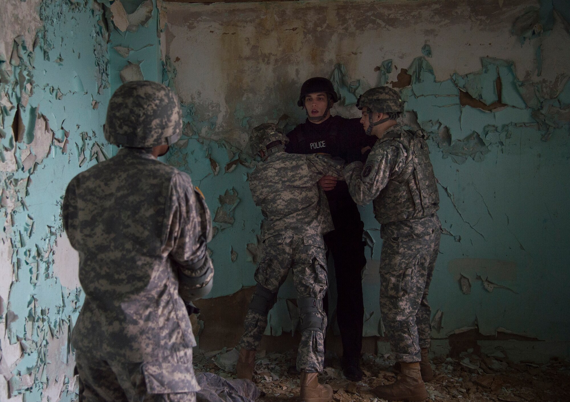 Senior Airman William Schuld, 11th Security Forces Squadron Emergency Services Team operator, is apprehended during training at the Tactical Combatives Course, a class conducted by the U.S. Army Combatives School, March 22, 2016.The course allows service members to get  realistic training without compromising their safety. (U.S. Air Force photo by Senior Airman Mariah Haddenham/released)
