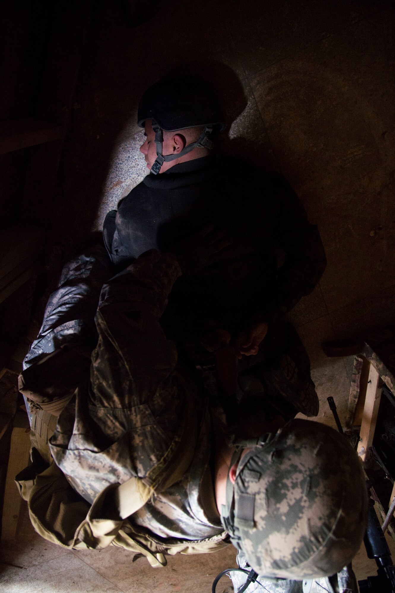 Staff Sgt. Gabriell Viera, 811th Security Forces Squadron executive aircraft security team leader, is apprehended during training at the Tactical Combatives Course, a class conducted by the U.S. Army Combatives School, March 22, 2016. The course focuses on warrior ethos and increasing confidence. (U.S. Air Force photo by Senior Airman Mariah Haddenham/released)