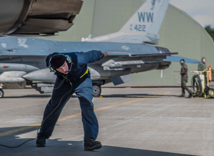 U.S. Air Force Airman Joseph Farmer, a crew chief with the 35th Maintenance Squadron, conducts a pre-flight check on an F-16 Fighting Falcon during exercise Beverly Sunrise 16-03 at Misawa Air Base, Japan, March 23, 2016. Misawa’s crew chiefs are responsible for ensuring every F-16 meets standards through regular inspections and maintenance. (U.S. Air Force photo by Airman 1st Class Jordyn Fetter) 