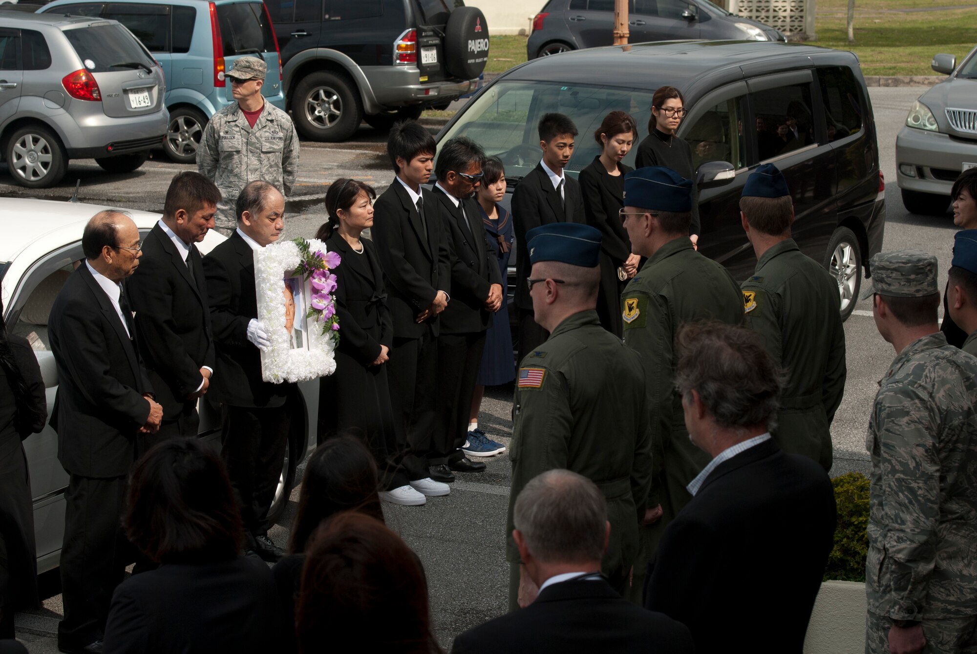 Family members of Jack Oshiro meet with Team Kadena group commanders and Jack's friends during a memorial procession March 18, 2016, at Kadena Air Base, Japan. Service members and their families paid homage to Mr. Oshiro's legacy as a major contributor to Kadena's community history. (U.S. Air Force photo by Senior Airman Peter Reft)