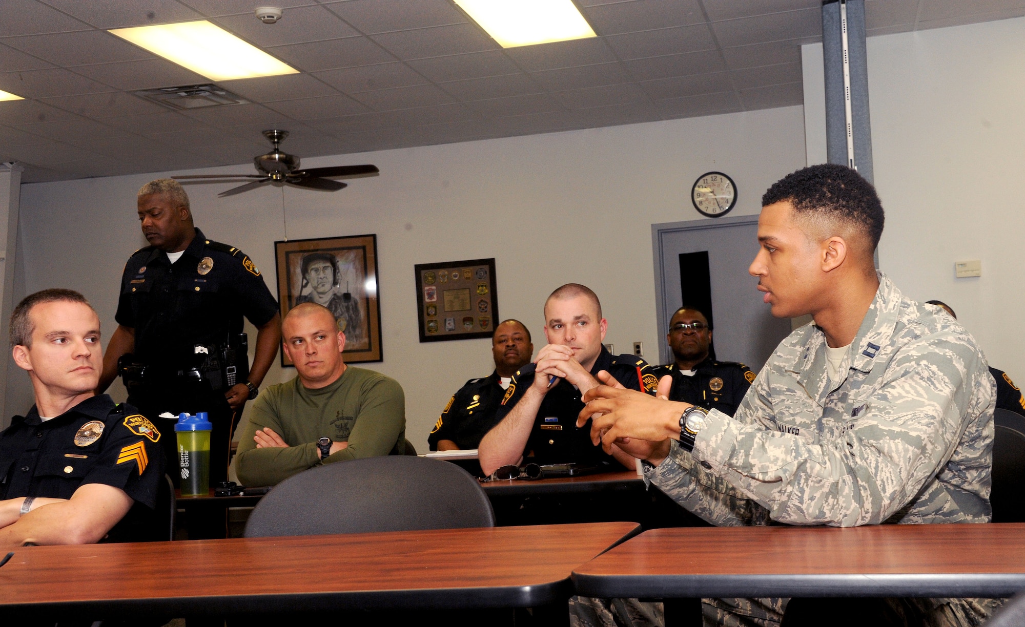 Capt. Kris Walker, Officer Training School chief of training, injects his perspective during a Montgomery Police Department Academy supervisory course March 15, 2016, Montgomery, Alabama. Walker is adding an Air Force outlook to the class as well as gathering material for a leadership consortium that partners OTS and the police academy together as a way to learn from one another. (U.S. Air Force photo by Airman 1st Class Alexa Culbert)