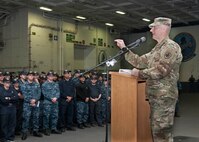 Army Command Sgt. Maj. John W. Troxell, the Senior Enlisted Advisor to the Chairman of the Joint Chiefs of Staff, addresses the crew of the aircraft carrier USS George Washington during an all-hands call in Norfolk, Va., March 23, 2016. Troxell visited the George Washington to highlight the chairman's priorities that include restoring joint readiness, improving joint warfighting and developing leaders. Navy photo by Petty Officer 1st Class Thomas Gagnier