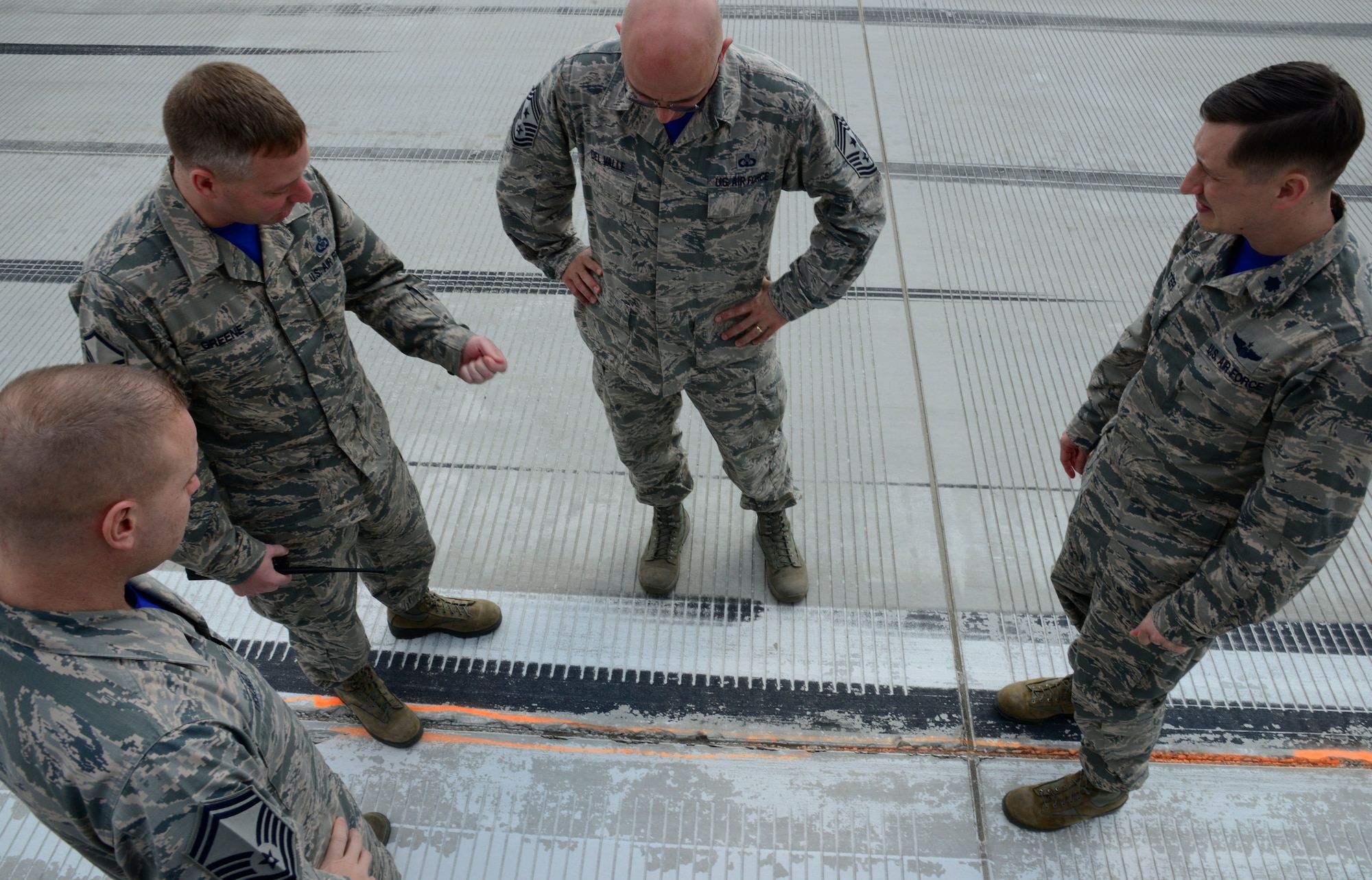 Master Sgt. Bryan Greene, 51st Operations Support Squadron deputy airfield manager, speaks with Chief Master Sgt. Alex Del Valle, 51st Fighter Wing command chief, during the chief’s immersion tour with the 51st Operations Group on Osan Air Base, Republic of Korea , March 25, 2016. The immersion provided an opportunity for Team Osan members to speak directly to the chief about accomplishments and limitations. “Our overall goal is to make Osan better with a stronger mission,” said Del Valle. (U.S. Air Force photo by Senior Airman Kristin High/Released)