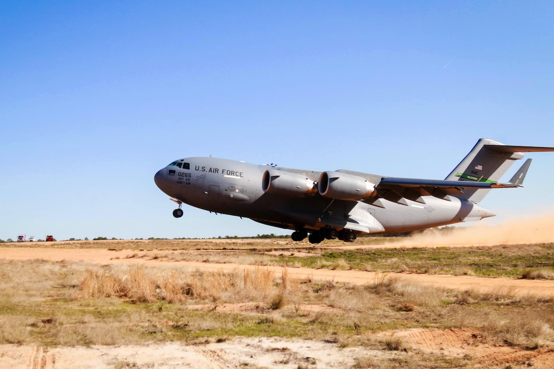 A Globemaster III aircraft takes off after offloading AH-64 Apache helicopters at Camp Mackall, N.C., March 17, 2016. Army photo by Capt. Adan Cazarez