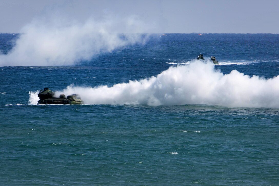 U.S. Marine Corps AAV7A1 tracked vehicles pop smoke during an amphibious assault mission during exercise Ssang Yong 16 near Pohang, South Korea, March 12, 2016. The vehicles are assigned to the 13th Marine Expeditionary Unit. Marine Corps photo by Lance Cpl. Sean M. Evans