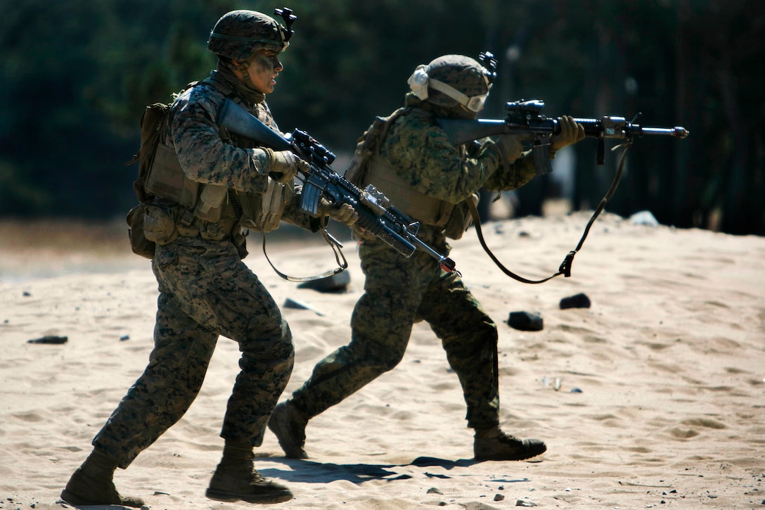 U.S. Marines move toward the next objective on a beach during exercise Ssang Yong 16 near Pohang, South Korea, March 12, 2016. Marine Corps photo by Lance Cpl. Sean M. Evans