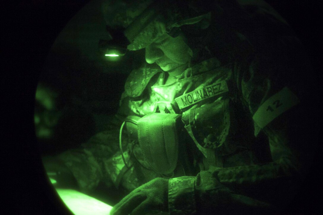 Army Sgt. 1st Class Nelson Molinarez participates in night land navigation during the Best Warrior competition at Fort Knox, Ky., March 22, 2016. Molinarez is assigned to the Army Reserves Career Division. The Best Warrior Competition is a four-day event that tests competitors' aptitude through urban warfare, board interviews, physical fitness tests, written exams, warrior tasks and battle drills. Army photo by Spc. Gabriel Prado