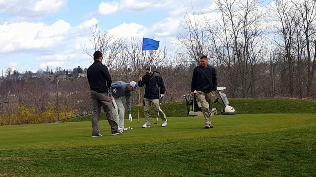 Participants compete for first place during the Riverview St. Patrick’s Day Golf Tournament on March 18.