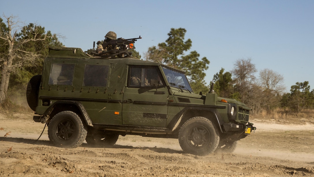 Dutch Marines with 32nd Raiding Company provide security in a Mercedes-Benz G-class utility vehicle for a Medium Tactical Vehicle Replacement 7-ton during a casualty evacuation exercise at Marine Corps Base Camp Lejeune, North Carolina, March 22, 2016. The Dutch Marines spent the past three weeks utilizing Camp Lejeune’s training facilities, as well as cross-trained with U.S. Marines to learn and share tactics, techniques and procedures. 