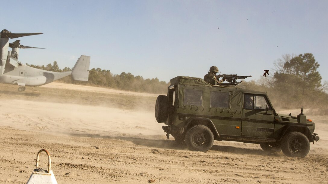 Dutch Marines with 32nd Raiding Company provide security in a Mercedes-Benz G-class utility vehicle  for a Medium Tactical Vehicle Replacement 7-ton during a casualty evacuation exercise at Marine Corps Base Camp Lejeune, North Carolina, March 22, 2016. The Dutch Marines spent the past three weeks utilizing Camp Lejeune’s training facilities, as well as cross-trained with U.S. Marines to learn and share tactics, techniques and procedures.