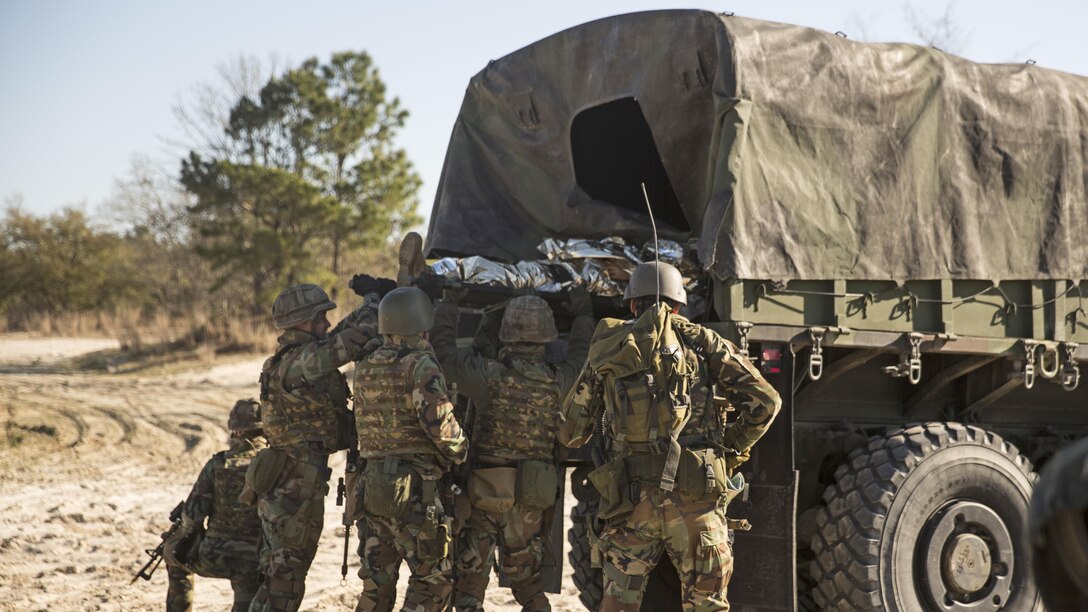 Dutch Marines with 32nd Raiding Company load the casualty onto a Medium Tactical Vehicle Replacement 7-ton during a casualty evacuation exercise at Marine Corps Base Camp Lejeune, North Carolina, March 22, 2016. The Dutch Marines spent the past three weeks utilizing Camp Lejeune’s training facilities, as well as cross-trained with U.S. Marines to learn and share tactics, techniques and procedures.
