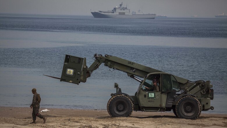 A U.S. Marine with Combat Logistics Battalion 31, 31st Marine Expeditionary Unit ground guides an Extended Boom Forklift to load equipment onto a Landing Craft Air Cushion assigned to Naval Beach Unit 7 during Exercise Ssang Yong 16, Dogu Beach, Pohang, South Korea, March 17, 2016. Ssang Yong 16 is a biennial combined amphibious exercise conducted by U.S. forces with the Republic of Korea Navy and Marine Corps, Australian Army and Royal New Zealand Army forces in order to strengthen interoperability and working relationships across a wide range of military operations. The Marines and sailors of the 31st MEU are currently deployed aboard the Bonhomme Richard Amphibious Ready Group as part of their spring deployment of the Asia-Pacific region.