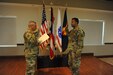 Col. Hector Moran, 1st Mission Support Command Deputy Command, administers the “Oath of Office” to 1st Lt. Anthony Carrillo during a commissioning ceremony at Ramos Hall, Fort Buchanan on March 23.  Carrillo direct commissioned into the JAG Corps.