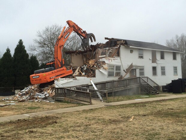 Soldiers Plaza building 2602, a World War II wood building used most recently as an administrative building, is demolished at Fort Benning, Georgia, under the Facilities Reduction Program, U.S. Army Engineering and Support Center, Huntsville. This is one of 31 World War II wood buildings within the Soldiers Plaza that has been demolished to reduce the installation's footprint by removing excess infrastructure from its real property inventory.