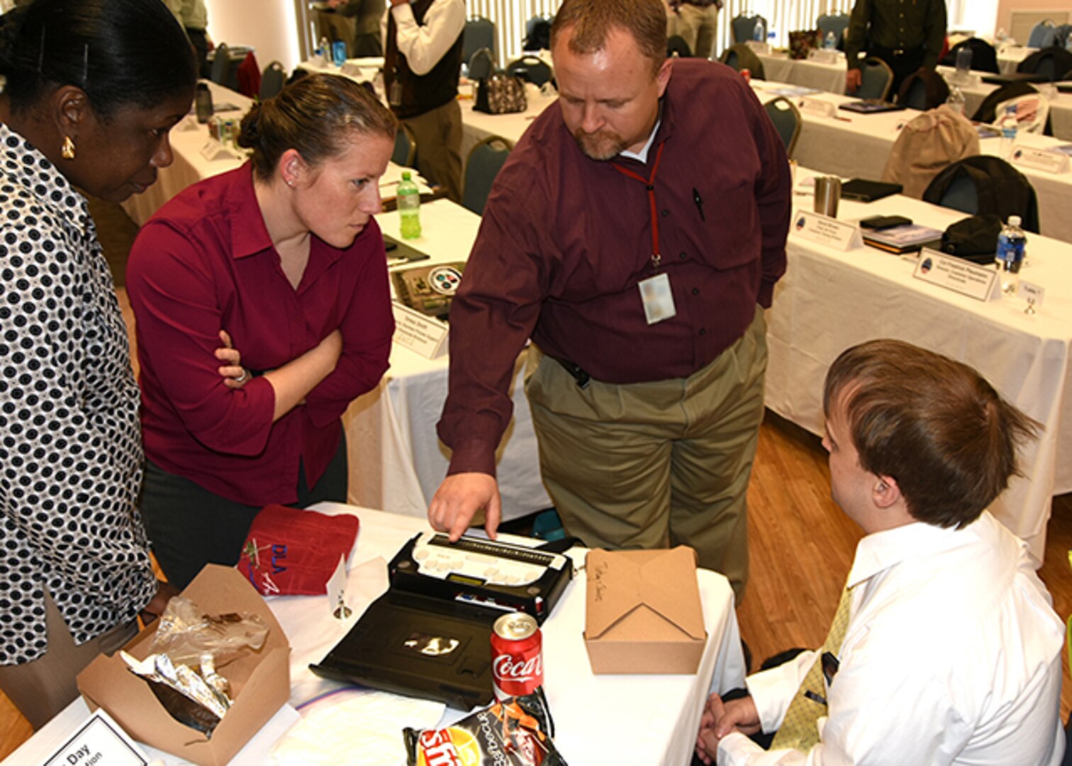Noel Romey, an information technology specialist with Defense Logistics Agency Information Operations at Richmond, shows Senior Leader Conference attendees his refreshable braille display March 3, 2016 after speaking to them about how practicing resiliency has help him face physical challenges.  The DLA Aviation Senior Leader Conference was held March 1-3 on Defense Supply Center Richmond, Virginia. 