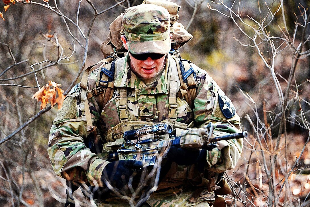 Army Sgt. Anthony Kirkpatrick moves toward an objective during a live-fire exercise at Rodriguez Live Fire Complex, South Korea, March 15, 2016. Army photo by Spc. Loren Keely