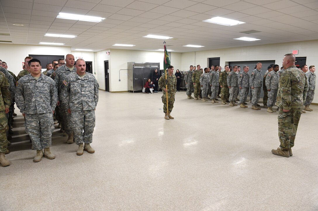Army Reserve soldiers assigned to the 814th Military Police Company, 327th MP Battalion, stand at attention in a brief formation during a Welcome Home ceremony at the Arlington Heights Reserve Center, March 23, 2016. The unit returned home early Wednesday morning after completing a 10-month deployment to Guantanamo Bay, Cuba.
(U.S. Army photo by Spc. David Lietz/Released)