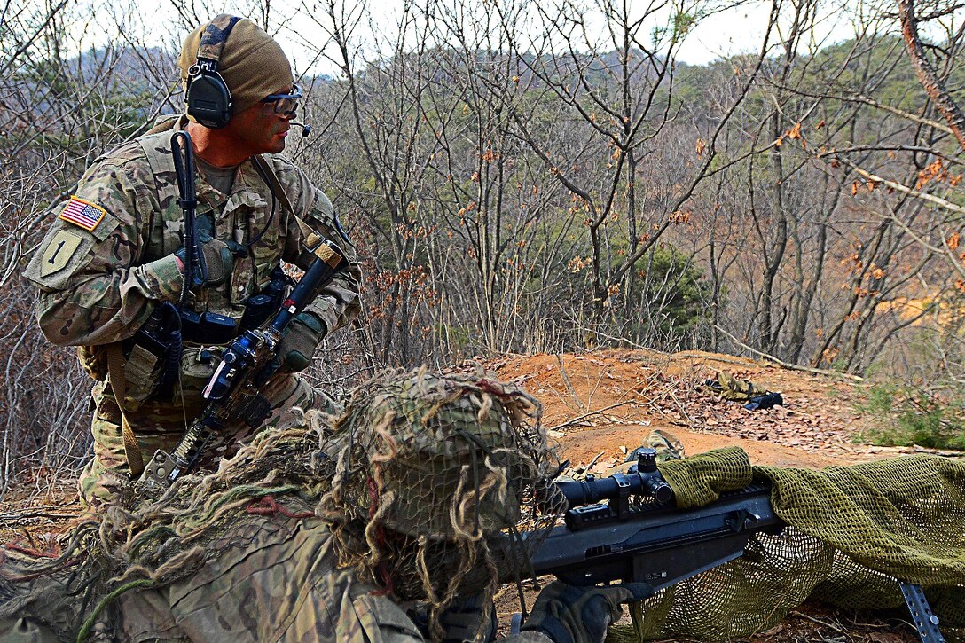 Army Sgt. Anthony Kirkpatrick, left, checks the fields of fire for Cpl. Jeremy Boldt before participating in a live-fire exercise at Rodriguez Live Fire Complex, South Korea, March 15, 2016. Kirkpatrick and Boldt are assigned to Company B, 2nd Battalion, 3rd Infantry Regiment. Army photo by Spc. Loren Keely
