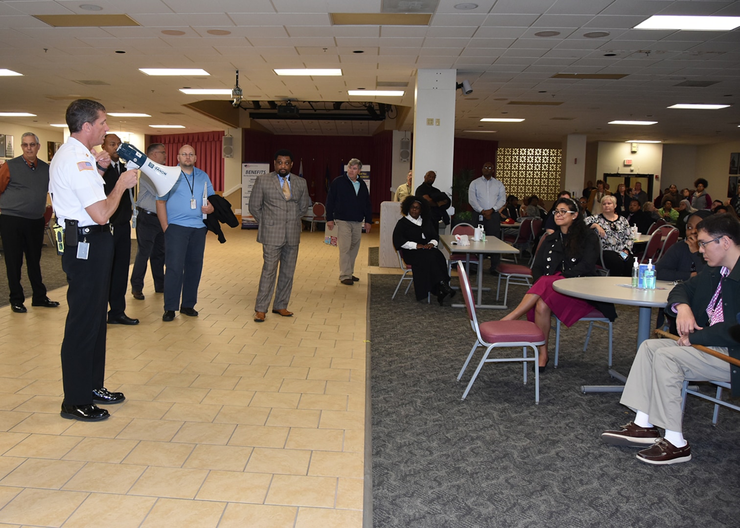 Donald Rogers, fire chief, Defense Logistics Agency Installation Support at Richmond addresses a group of employees inside the Center Restaurant on Defense Supply Center Richmond, Virginia, who participated in the installation’s tornado drill March 22, 2016. 