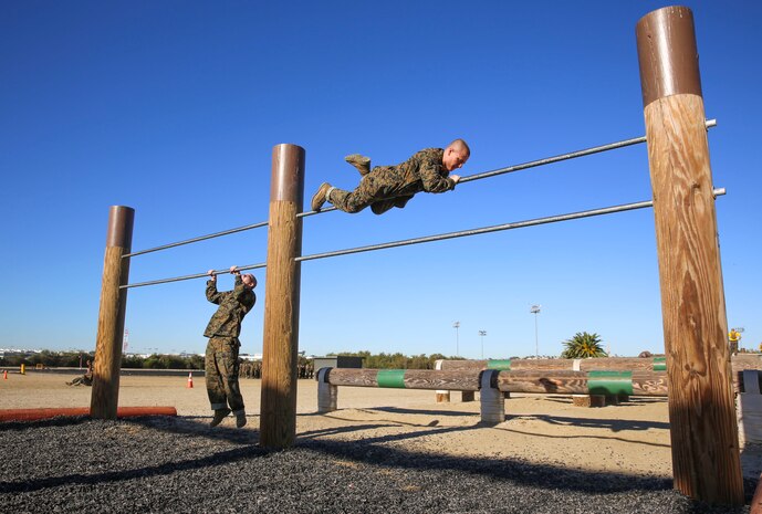 Recruits of Fox Company, 2nd Recruit Training Battalion, maneuver over the high bars during Obstacle Course II at Marine Corps Recruit Depot San Diego, March 24. The recruits were taught various techniques to assist them in completing the obstacles. The course tested the recruits’ upper and lower body strength. Annually, more than 17,000 males recruited from the Western Recruiting Region are trained at MCRD San Diego. Fox Company is scheduled to graduate June 3.