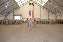 Soldiers of the 392nd Expeditionary Signal Battalion stand in formation during a deployment ceremony on March 26, 2016 at Fort Meade, Md.