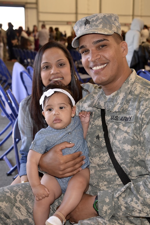 Soldiers spend time with their families at the conclusion of a deployment ceremony held for the 392nd ESB at Fort Meade, Md. March 26, 2016