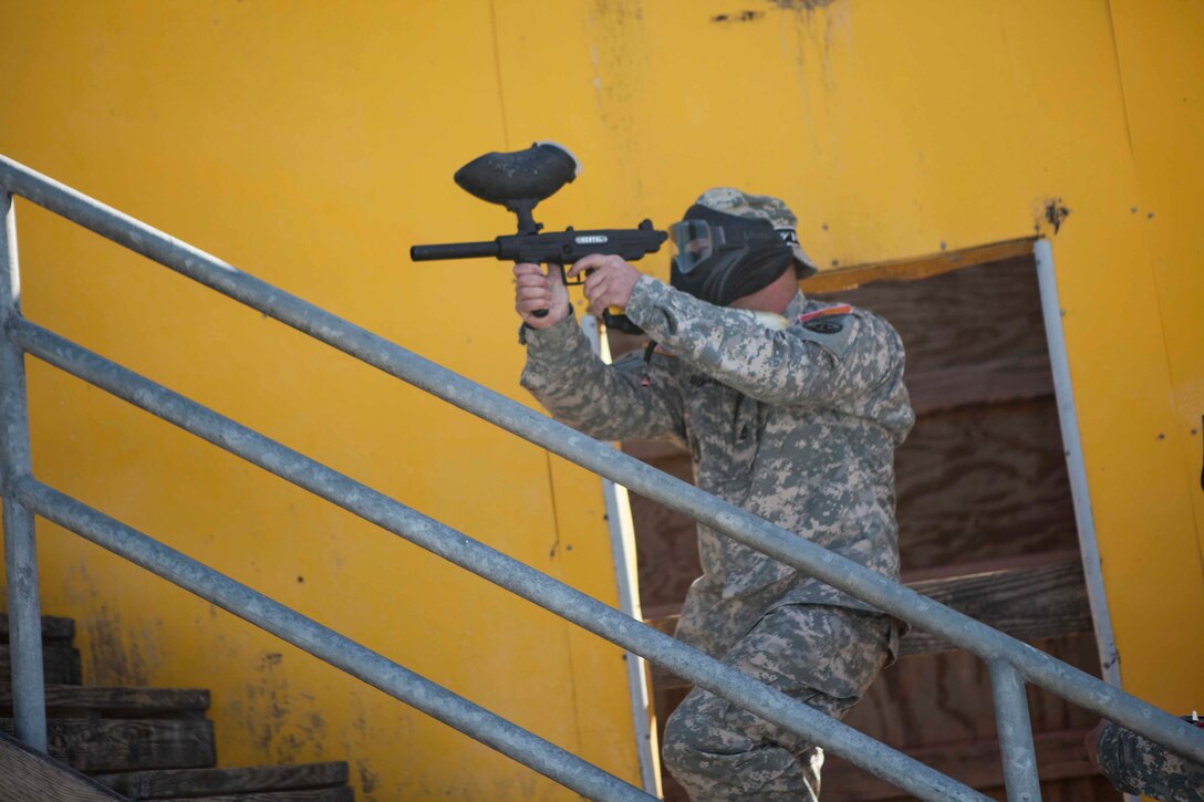 Joint Best Warrior Competition competitior U.S. Army  Sgt. First Class Anthony Bohanon of the Army Reserve Careers Division returns fire during the urban assault course March 22nd, 2016 at Ft. Knox, Kentucky. The Best Warrior Competition is a four-day competition that tests competitors' Army aptitude by going through urban warfare situations, board interviews, physical fitness tests, written exams, Warrior tasks and battle drills relevant to today's operational environment. (U.S. Army photo by Sgt. Amber Stephens)