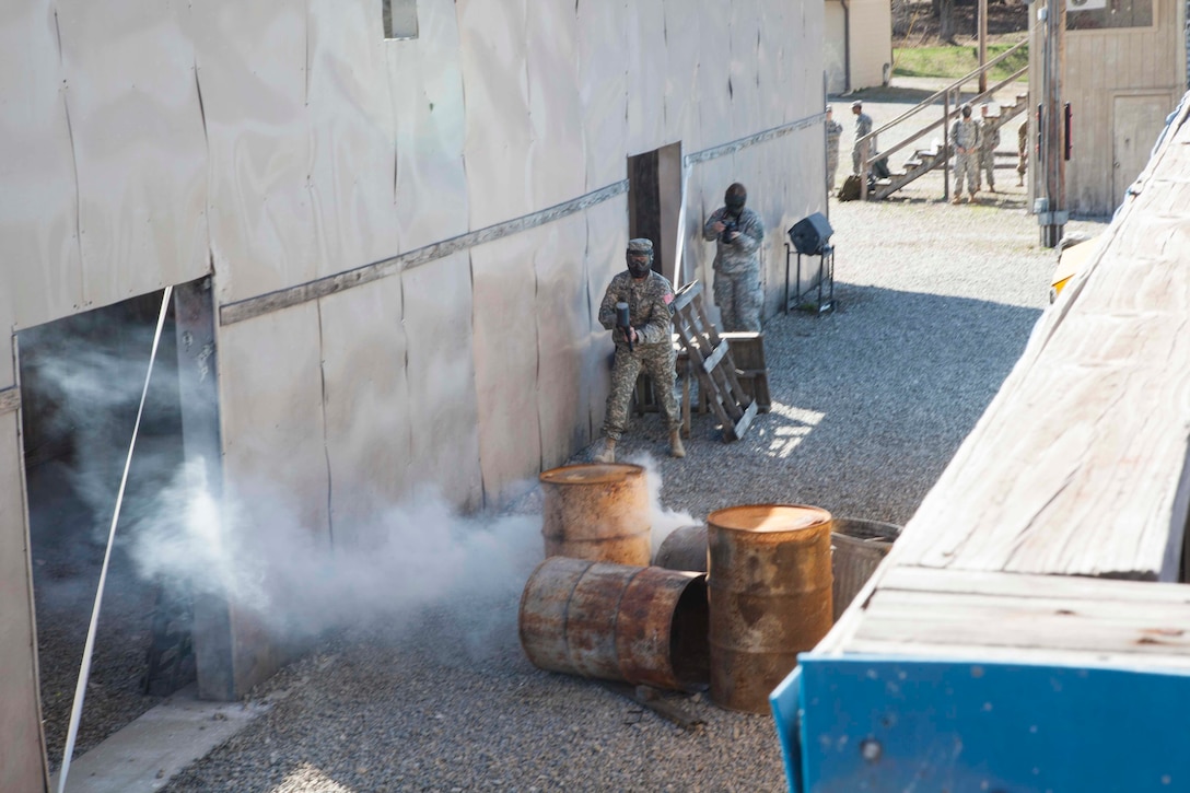 U.S. Army 84th Reserve Training Commands' Sgt Elizabeth Fowler moves through the urban assault course as part of the joint Best Warrior Competiton March 22nd, 2016 on Ft. Knox, Kentucky. The Best Warrior Competition is a four-day competition that tests competitors' Army aptitude by going through urban warfare situations, board interviews, physical fitness tests, written exams, Warrior tasks and battle drills relevant to today's operational environment. (U.S. Army photo by Sgt. Amber Stephens)