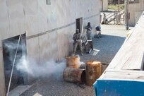 U.S. Army 84th Reserve Training Commands' Sgt Elizabeth Fowler moves through the urban assault course as part of the joint Best Warrior Competiton March 22nd, 2016 on Ft. Knox, Kentucky. The Best Warrior Competition is a four-day competition that tests competitors' Army aptitude by going through urban warfare situations, board interviews, physical fitness tests, written exams, Warrior tasks and battle drills relevant to today's operational environment. (U.S. Army photo by Sgt. Amber Stephens)