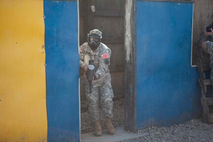 U.S. Army Reserve Careers Division Sgt. First Class Harrt Torresramos moves through the urban assault course as part of the joint Best Warrior Competiton March 22nd, 2016 on Ft. Knox, Kentucky. The Best Warrior Competition is a four-day competition that tests competitors' Army aptitude by going through urban warfare situations, board interviews, physical fitness tests, written exams, Warrior tasks and battle drills relevant to today's operational environment. (U.S. Army photo by Sgt. Amber Stephens)