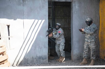 U.S. Army Reserve Careers Division Sgt. First Class Harrt Torresramos moves through the urban assault course as part of the joint Best Warrior Competiton March 22nd, 2016 on Ft. Knox, Kentucky. The Best Warrior Competition is a four-day competition that tests competitors' Army aptitude by going through urban warfare situations, board interviews, physical fitness tests, written exams, Warrior tasks and battle drills relevant to today's operational environment. (U.S. Army photo by Sgt. Amber Stephens)