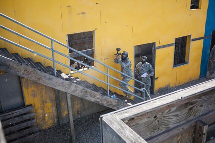 A competitor in the joint Best Warrior Competition hosted by 84th Reserve Command moves through the urban assault course on March 22nd, 2016 at Ft. Knox, Kentucky. The Best Warrior Competition is a four-day competition that tests competitors' Army aptitude by going through urban warfare situations, board interviews, physical fitness tests, written exams, Warrior tasks and battle drills relevant to today's operational environment. (U.S. Army photo by Sgt. Amber Stephens)