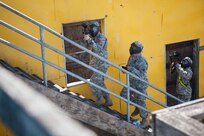 U.S. Army 11th Aviation Commands' Sgt. Jordan Sapp moves through the urban assault course as part of the joint Best Warrior Competiton March 22nd, 2016 on Ft. Knox, Kentucky. The Best Warrior Competition is a four-day competition that tests competitors' Army aptitude by going through urban warfare situations, board interviews, physical fitness tests, written exams, Warrior tasks and battle drills relevant to today's operational environment. (U.S. Army photo by Sgt. Amber Stephens)