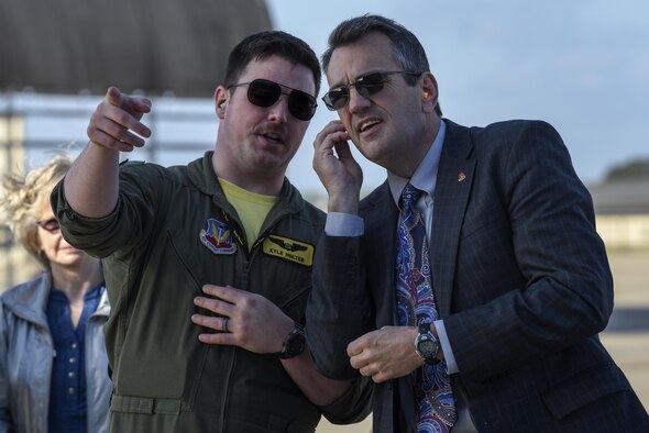 U.S. Air Force 1st Lt. Kyle Holter (left), 336th Fighter Squadron weapons system officer,
 shows Michael Dunsmore, Wayne County Public Schools superintendent, how an F-15E Strike Eagle gets launched, March 25, 2016, at Seymour Johnson Air Force Base, North Carolina. Members of the community received a squadron tour and were taken to the flightline to see jets launched for Razor Talon. (U.S. Air Force photo/Airman Shawna L. Keyes)