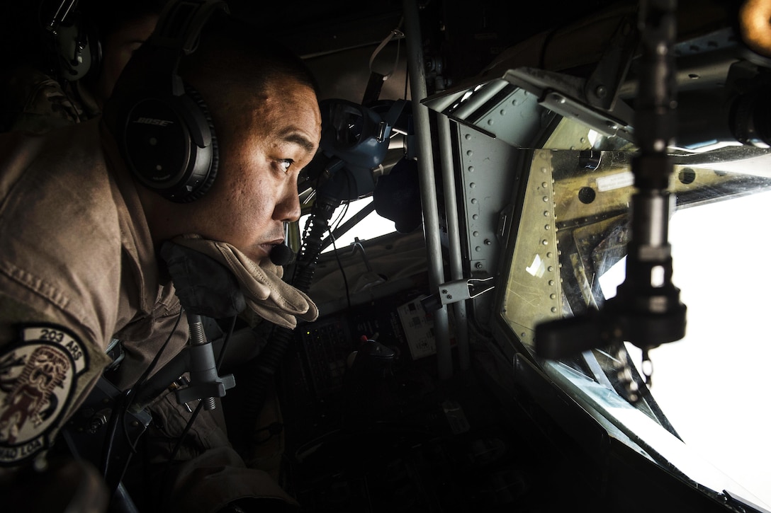 Air Force Staff Sgt. Caesar Lazaro operates the boom of a KC-135 Stratotanker aircraft in support of Operation Inherent Resolve over Iraq, March 22, 2016. Lazaro is a boom operator assigned to the Hawaii Air National Guard’s 203rd Air Refueling Squadron. Air Force photo by Staff Sgt. Corey Hook
